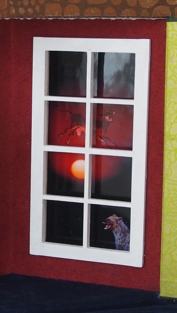 A window frame reveals a striking scene: a sun setting in a fiery red sky, with a hyena and an abstract creature in motion, creating a vivid contrast.
